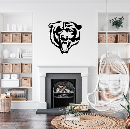 bear metal face on white wall above indoor fireplace living room 