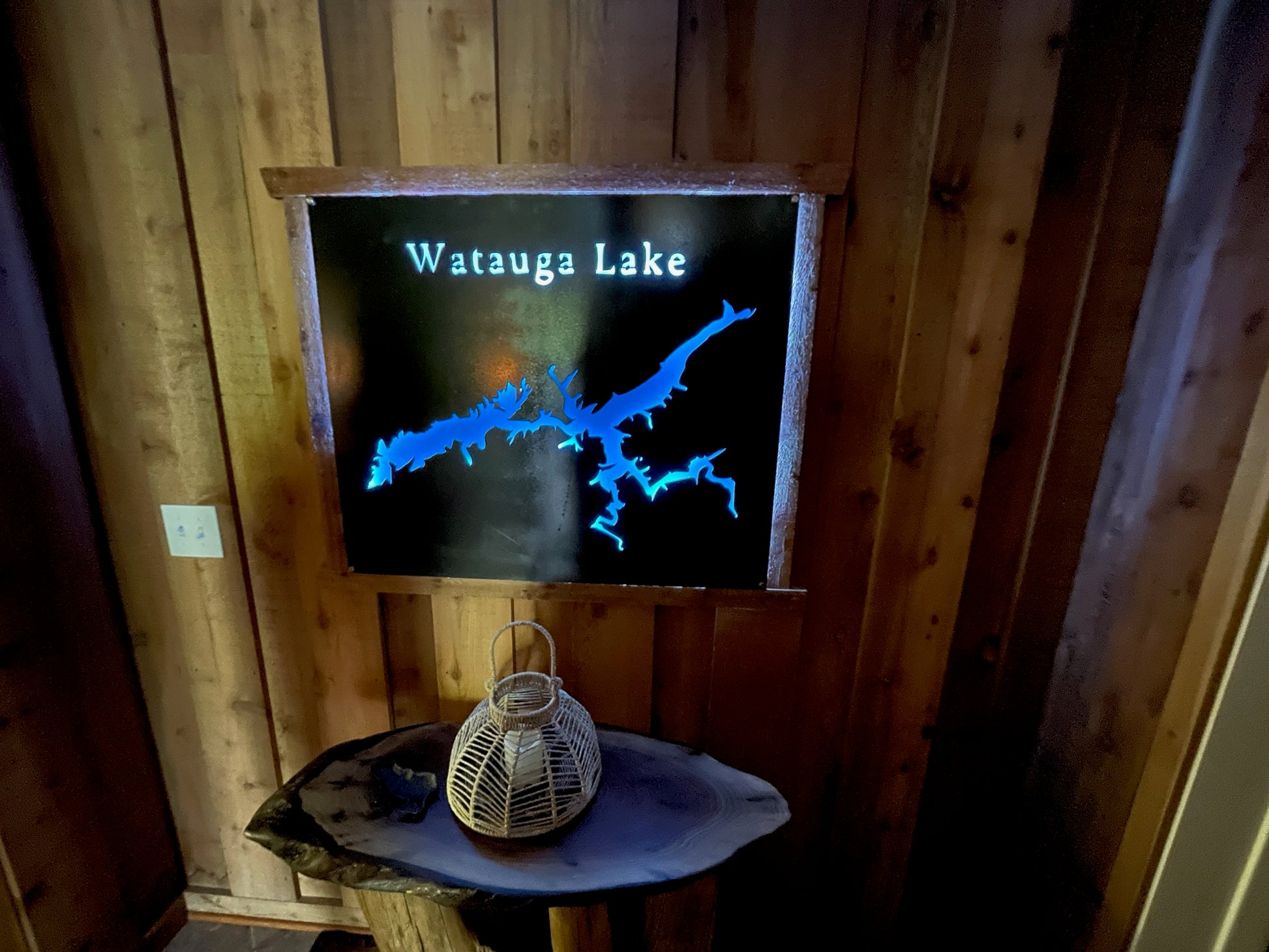 Custom laser-cut lake wall art displayed on a rustic wood wall